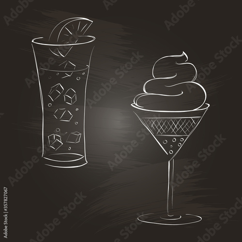 Glass of lemonade and dessert on a blackboard.