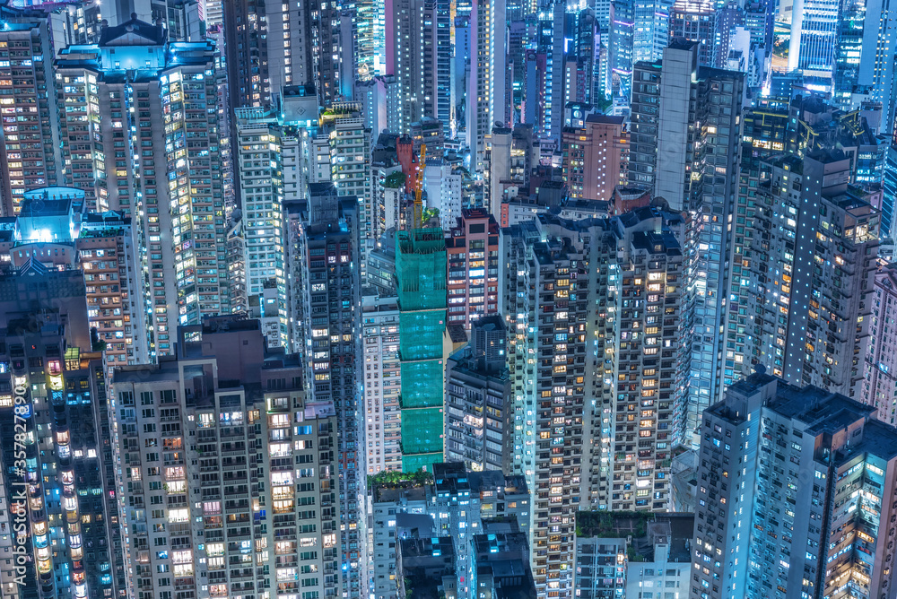 Obraz premium Aerial view of crowded high rise building in Hong Kong city at night