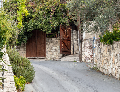 Fototapeta Naklejka Na Ścianę i Meble -  Narrow street in tourist ancient village of Lania, Cyprus