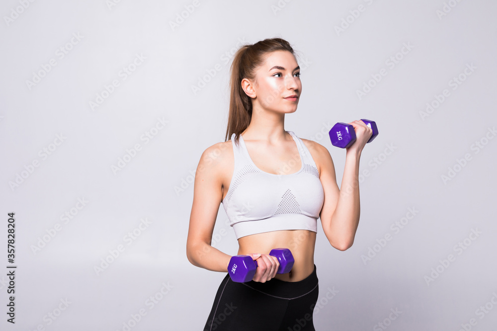 Portrait of pretty sporty girl holding weights isolated on white background Portrait of pretty sporty girl holding weights isolated on white background