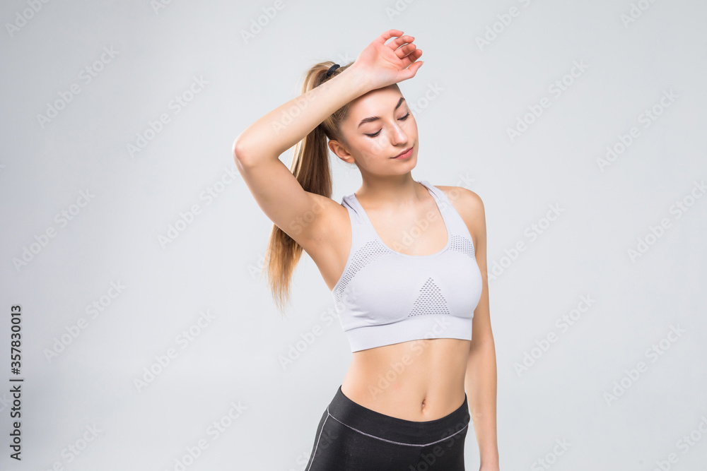 Fototapeta premium portrait of sporty woman look tired after workout on white background