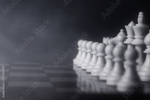 White chess pieces on chess board