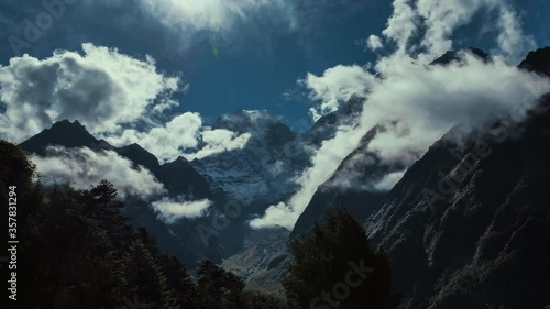 Time lapse of  Thamserku summit in the sky with clouds, Khumbu, Nepal mountain range photo