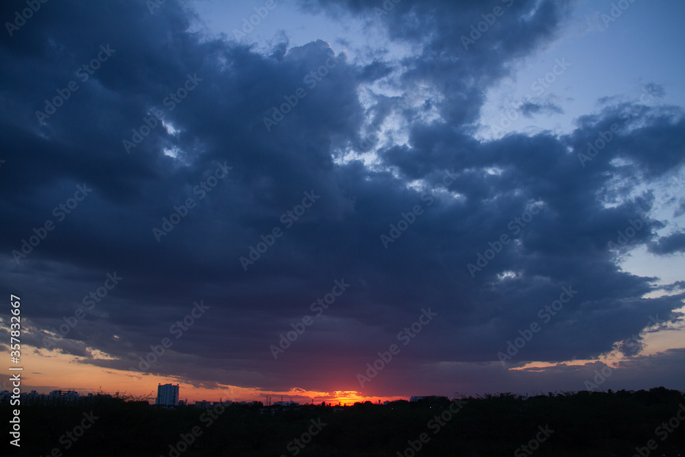 wide blue clouds dark sunset black sillhoutte wide blue clouds dark sunset black sillhoutte