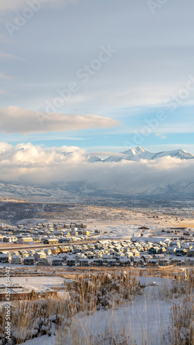 Vertical Mountain and residential neighborhood in Utah Valley on a snowy winter day