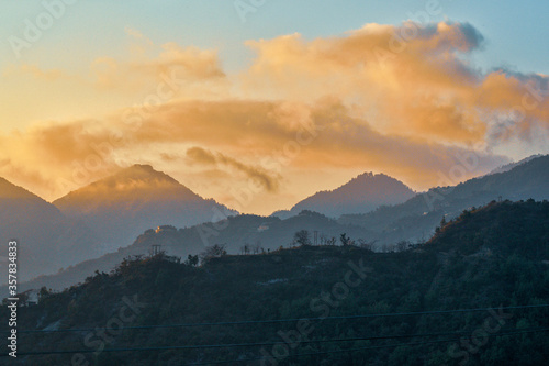 clouds over the mountains during sunset