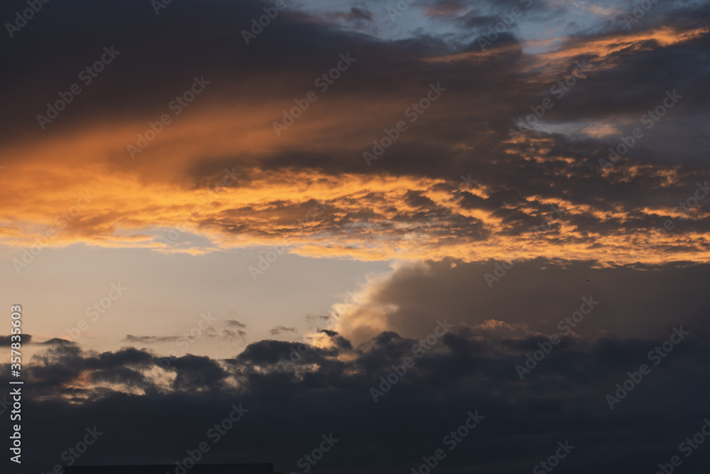 dramatic sky at sunset with clouds