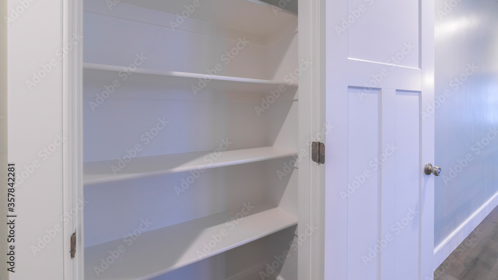 Panorama Empty white wooden shelves in a cupboard Panorama Empty white wooden shelves in a cupboard