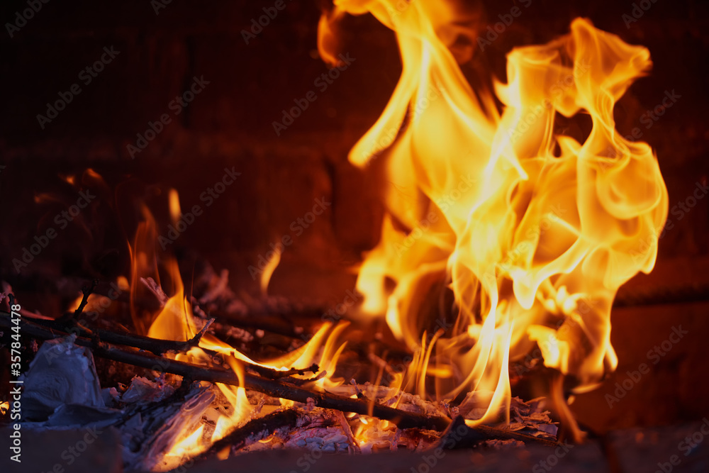Fire in the hearth burning brightly. Traditional farmhouse fireplace. Natural photo story. Perfect illustration hot for your page magazine Fire in the hearth burning brightly. Traditional farmhouse fireplace. Natural photo story. Perfect illustration hot for your page magazine