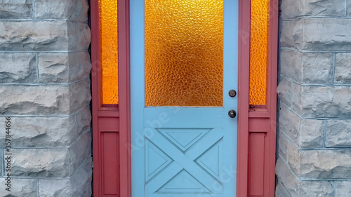 Panorama Frosted glass panes on the front door sidelights and transom window of home photo