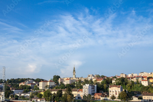 Panorama of the old city of Belgrade with a focus on Saint Michael Cathedral, also known as Saborna Crkva, with its iconic clocktower seen from afar. belgrade is the capital city of Serbia. © Jerome