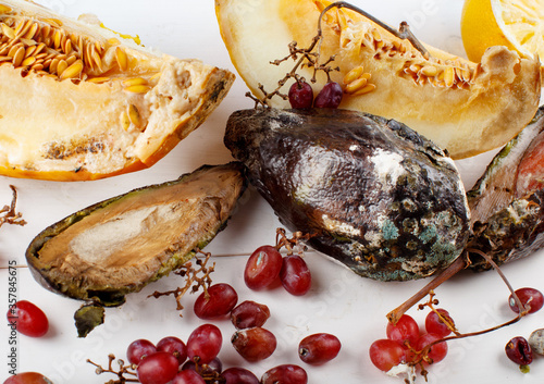 Fototapeta Naklejka Na Ścianę i Meble -  Rotten fruits on white background, Zero waste concept
