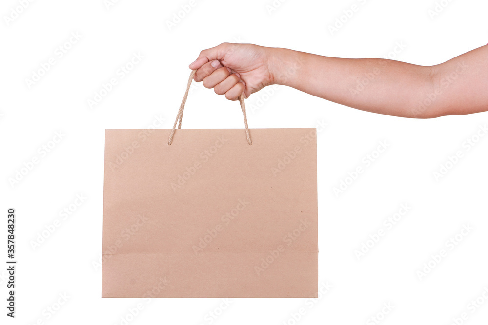 Hand Holding Paper Bag isolated on White Background. Hand Holding Paper Bag isolated on White Background.