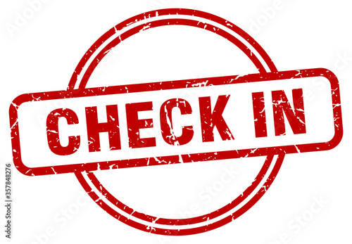 check in grunge stamp. check in round vintage stamp