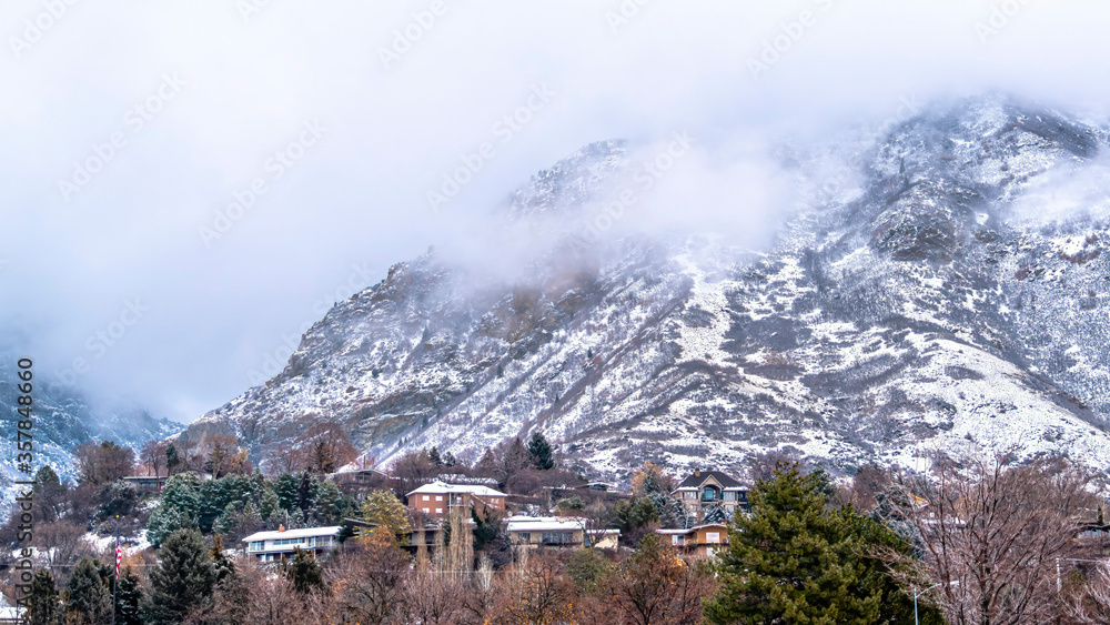 Panorama Rocky Provo Canyon in Utah blanketed with thick clouds and dusted with snow Panorama Rocky Provo Canyon in Utah blanketed with thick clouds and dusted with snow