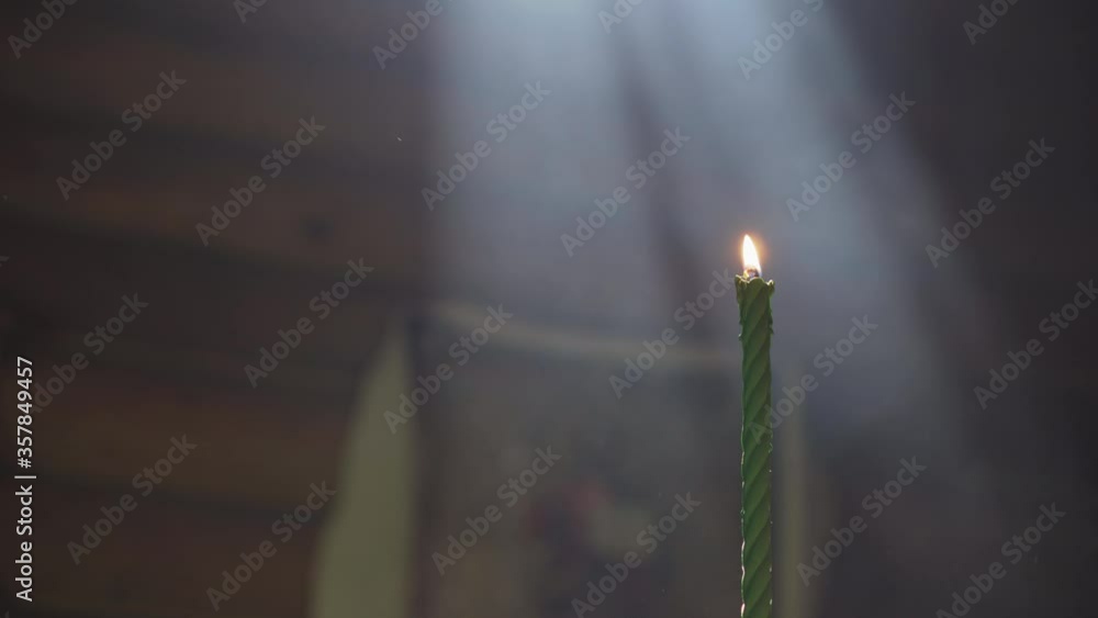 Light Rays From Candle Religion, holidays, cult concept - One single candle in rays of light ...