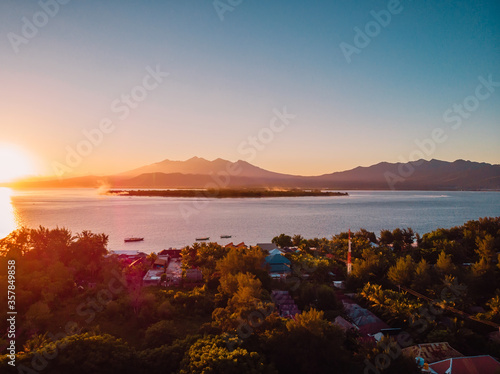 Aerial view with sunrise at Gili islands and sea. Gili Meno, Gili Air and Lombok