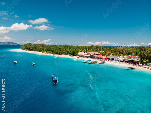 Tropical island with paradise beach and turquoise sea. Aerial view of Gili Meno