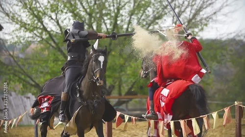 Vintage armored knights fighting demonstration.