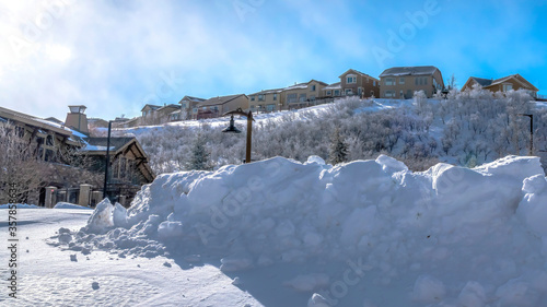 Panorama crop Town nestled amid sweeping terrain of Wasatch Mountain with snow in winter