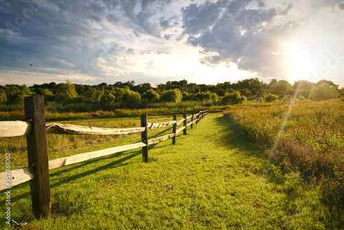 The sun sets over a ranch fence in North Texas. photo