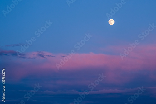 Beautiful moon in the dusk. Landscape format.