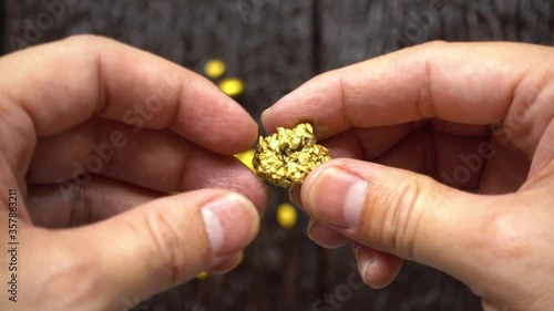 The miners carried the pure gold in their hands found in the mine into consideration.