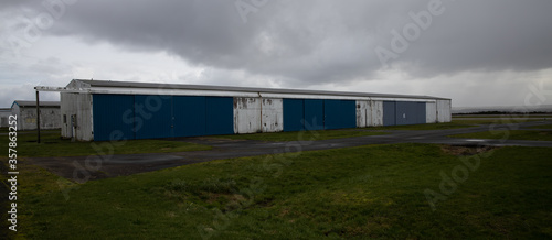 Abandoned airport hanger with large, locked storage rooms