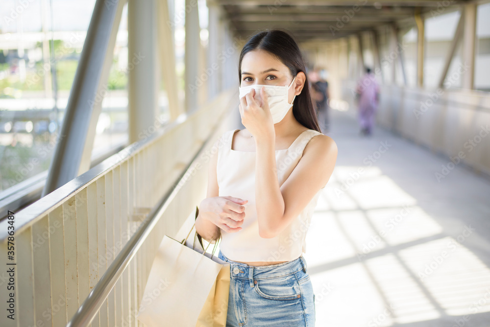 Young woman with face mask is standing outdoor City Young woman with face mask is standing outdoor City