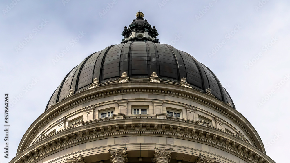 Panorama Dome and pediment of Utah State Capital building in Salt Lake City against sky