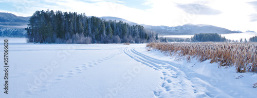The sun rises over a frozen Grand Lake in Colorado, USA