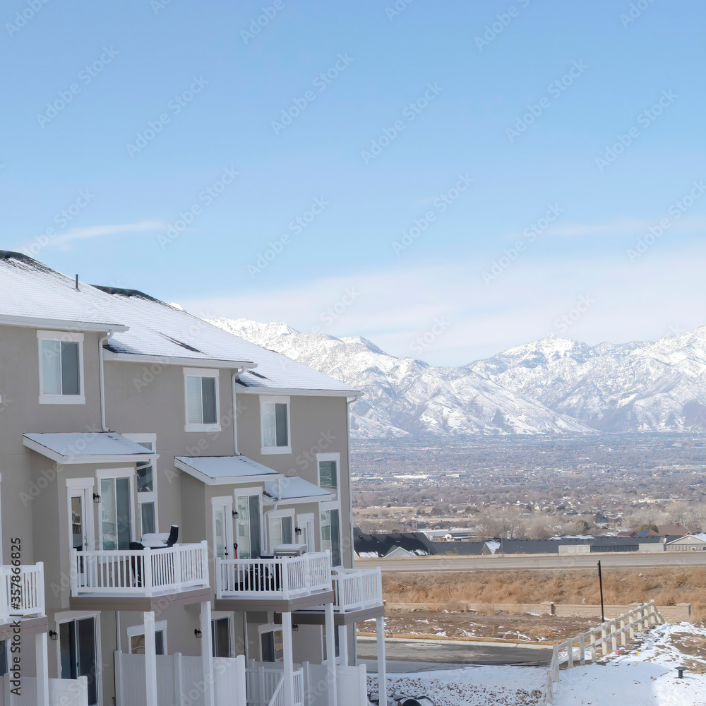 Square crop Peaceful neighborhood in South Jordan City with view of distant Wasatch Mountain