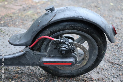Fototapeta Naklejka Na Ścianę i Meble -  scooter wheels with brake on ground