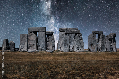 Stonehenge beneath the Milky Way in silvery blue light