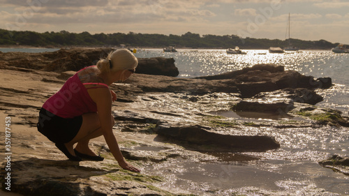 young woman walking on the beach