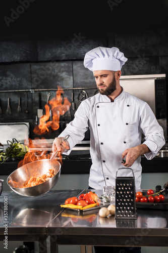 Принти на полотні Chef prepare food with fire at kitchen restaurant