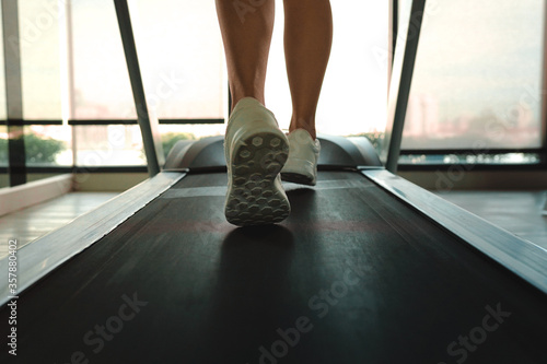 Close up woman running on machine treadmill at fitness concept for exercising, fitness and healthy.