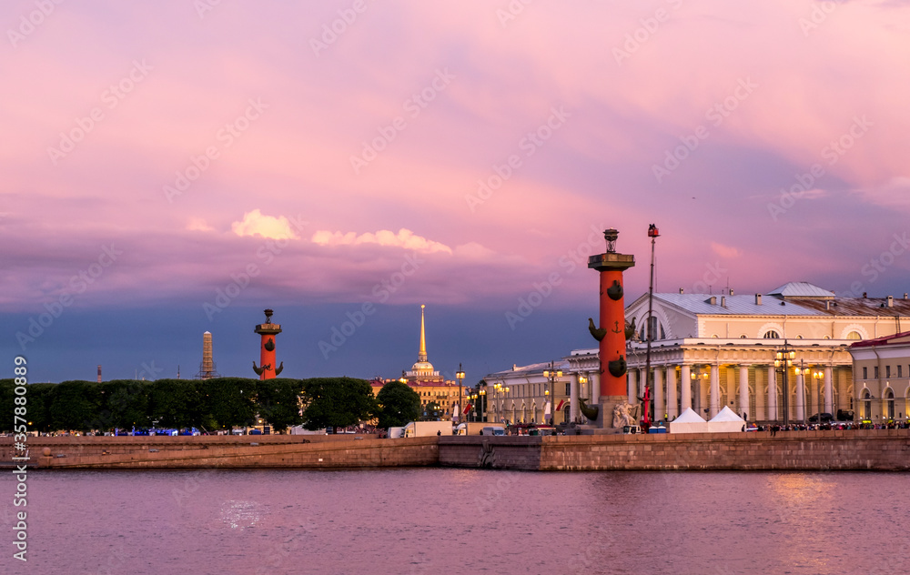 Rostral columns lit by illumination of the white nights at dawn in Saint Petersburg