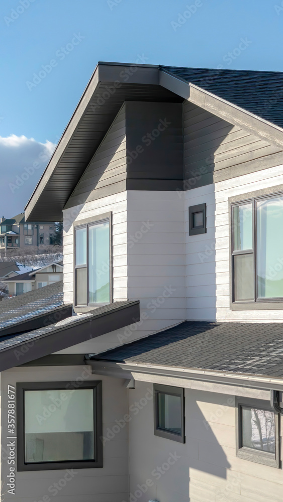Vertical frame Homes with wooden wall siding at the residential community of Wasatch Mountains Vertical frame Homes with wooden wall siding at the residential community of Wasatch Mountains