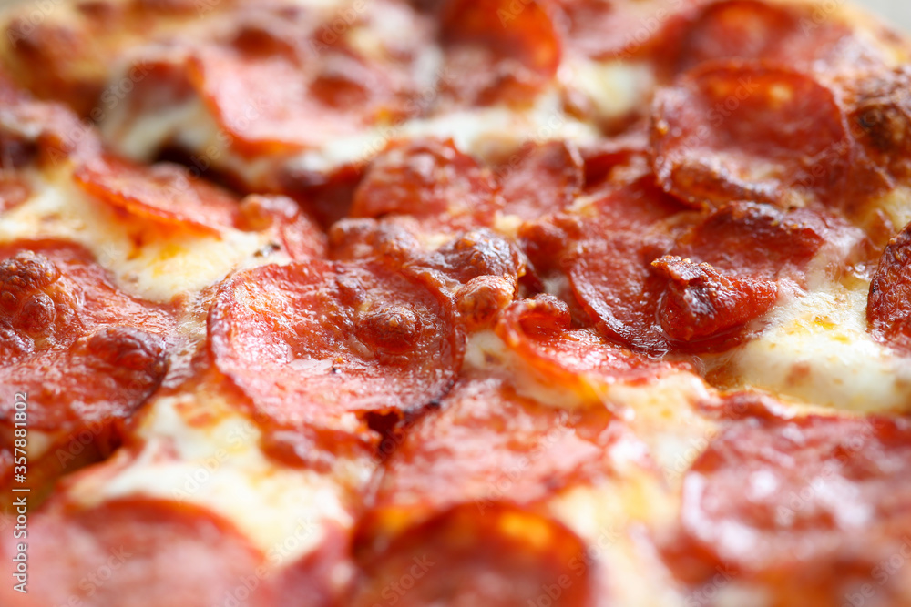 Fresh baked pizza with crusty cheese and hot tasty pepperoni ready to eat Fresh baked pizza with crusty cheese and hot tasty pepperoni ready to eat