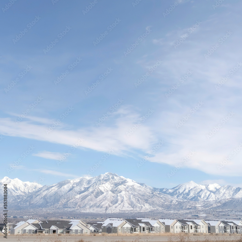 Square crop Panoramic view of South Jordan City neighborhood and Wasatch Mountains in winter