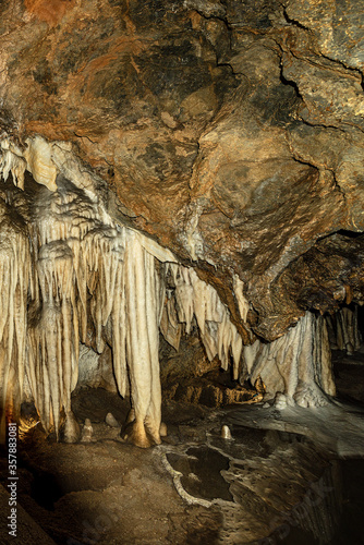 Close-up of a mountain cave with stalactites and stalagmites in Tuscany, Italy, Europe