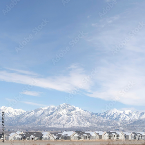 Square crop Panoramic view of South Jordan City neighborhood and Wasatch Mountains in winter