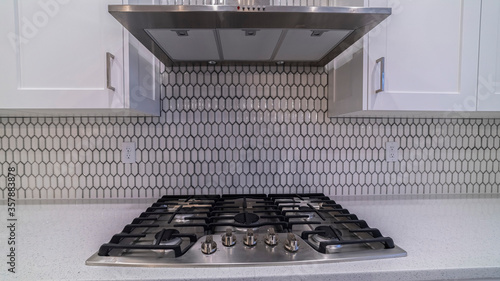 Panorama frame Modern gas cooker hob under an extractor fan