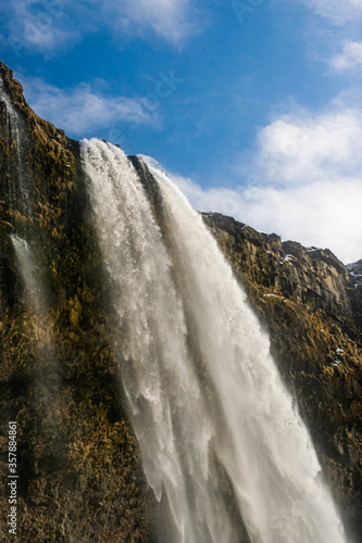 Photo of a waterfall in Iceland from the bottom. Impressive. Holidays and travel