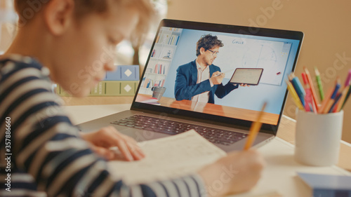 Canvastavla Smart Little Boy Uses Laptop for Video Call with His Teacher