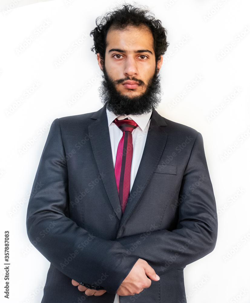 Muslim man wearing tuxedo and crossing his hands Muslim man wearing tuxedo and crossing his hands