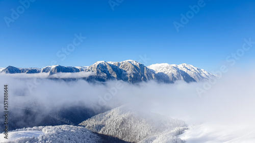 Romania  Baiului Mountains  viewpoint to Bucegi Mountains  snow covered mountains