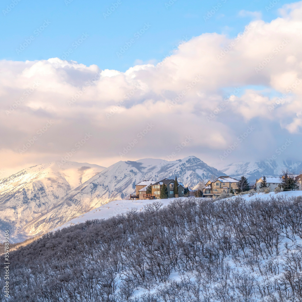Square Picturesque Wasatch Mountains view with houses on a snowy setting in winter