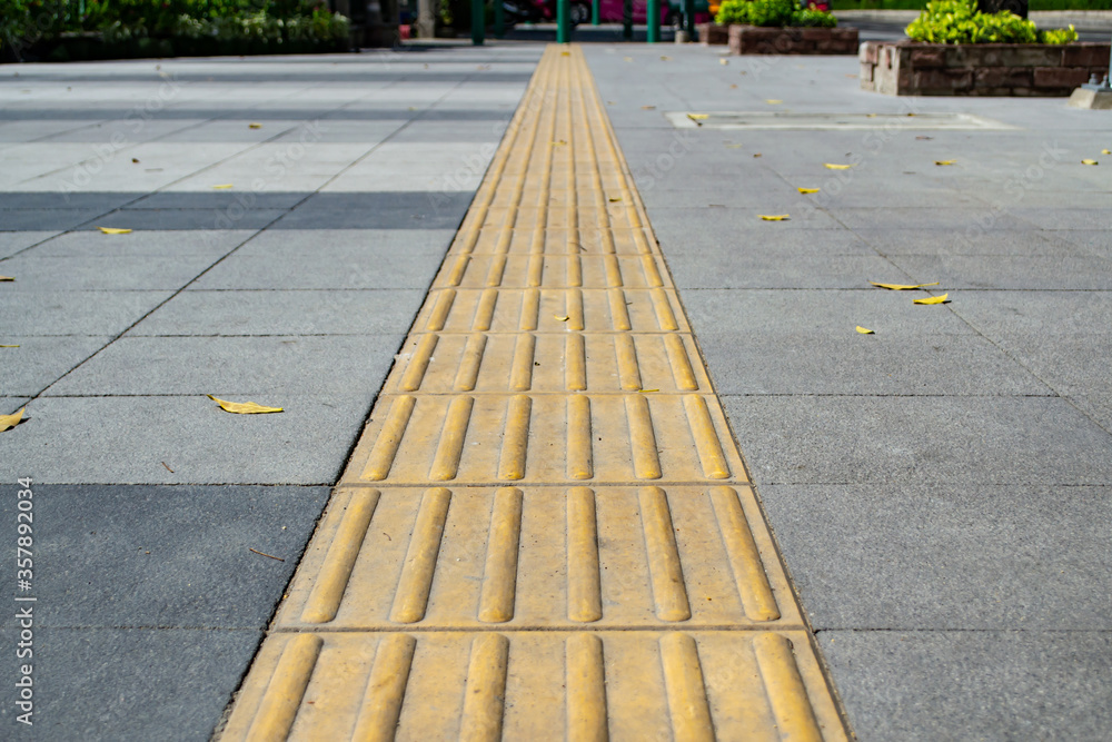 Tactile paving on footpath for blind pedestrians